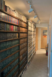 Art Vuolo's hallway is lined floor to ceiling with media. (Image: D. Holdship)