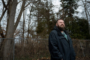Timothy Richards, a disabled U.S. Army veteran, stands outside the Northwest Michigan Health Services clinic in Traverse City where he receives free dental care from University of Michigan Dental School faculty and students.