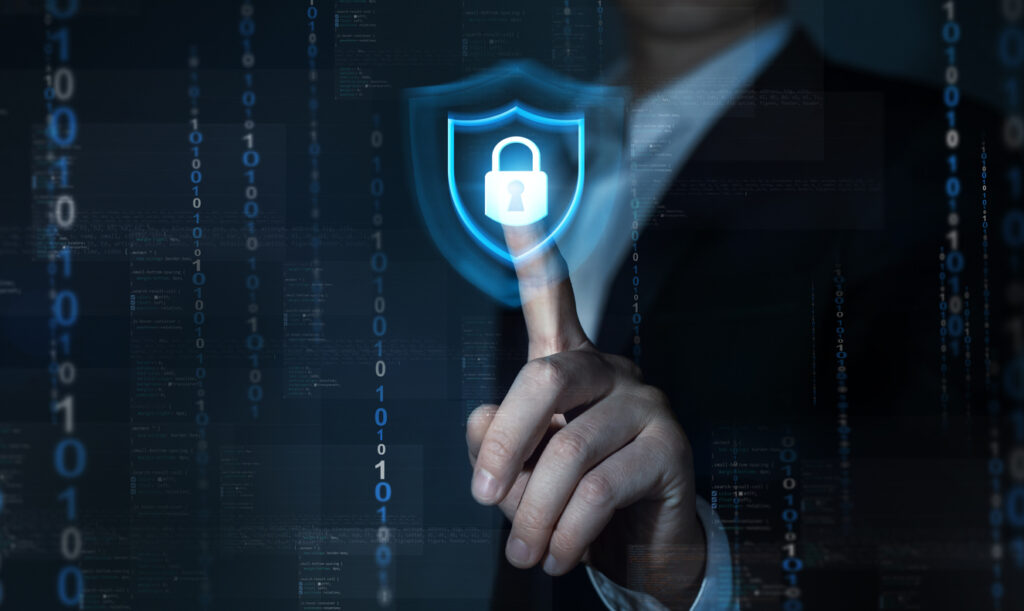 Concept illustration of a man in a suit touching a holographic lock. Image credit: iStock