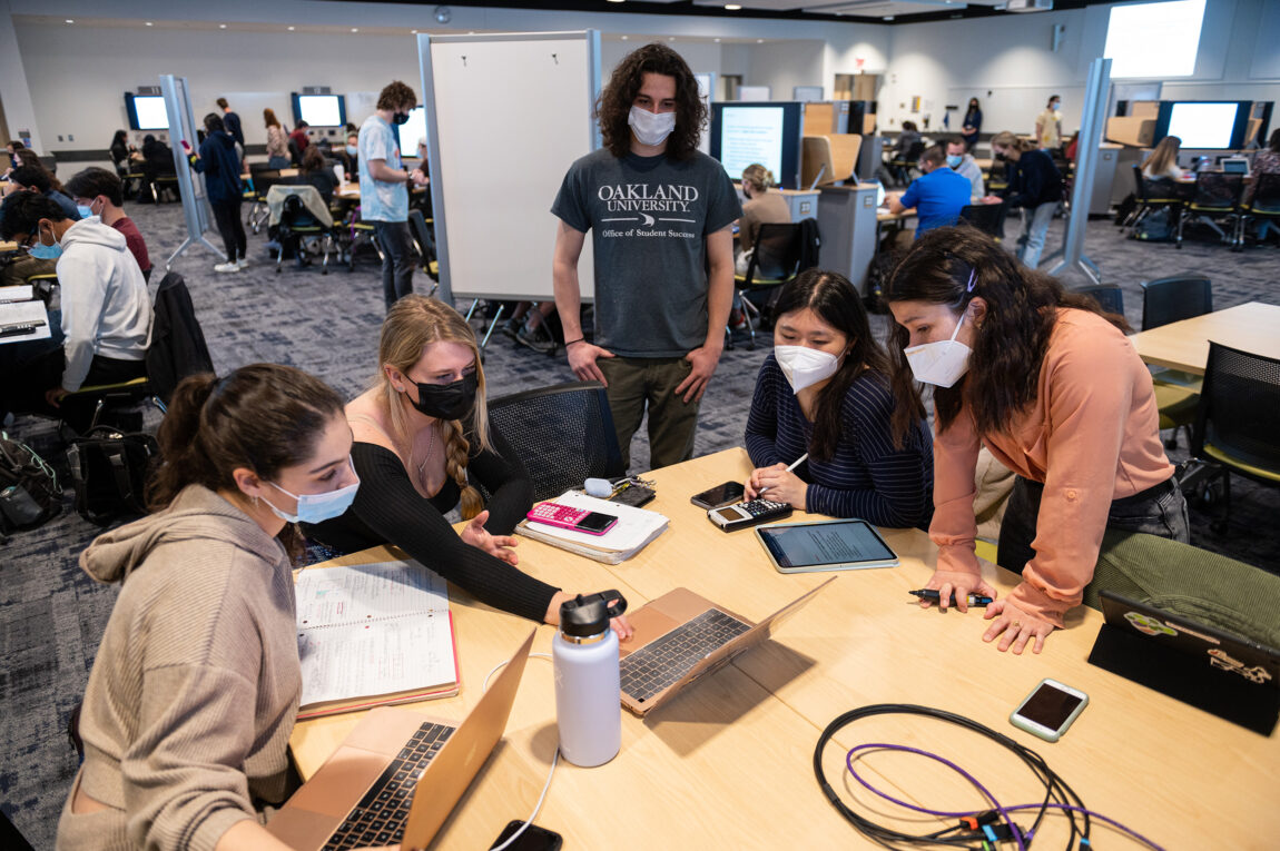 Students work in small groups in a classroom in the CCCB. (Photo by Austin Thomason, Michigan Photography)