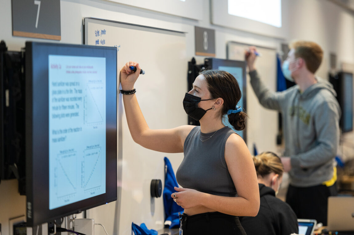 Students write on whiteboards in the new CCCB. (Photo by Austin Thomason, Michigan Photography)