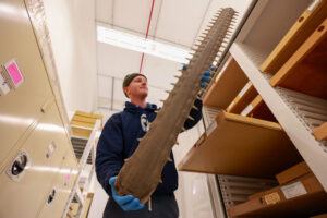 Charlie Engelman and a big long saw-looking bone.