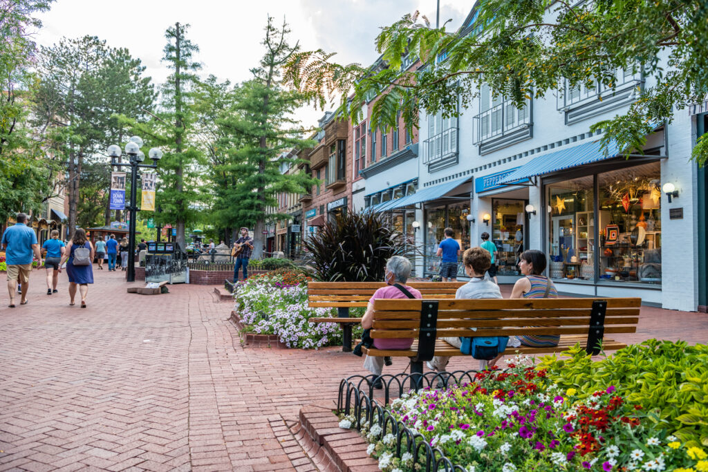 In Boulder, Colorado, friends sit together and enjoy the evening on the Pearl Street Mall. Image credit: iStock