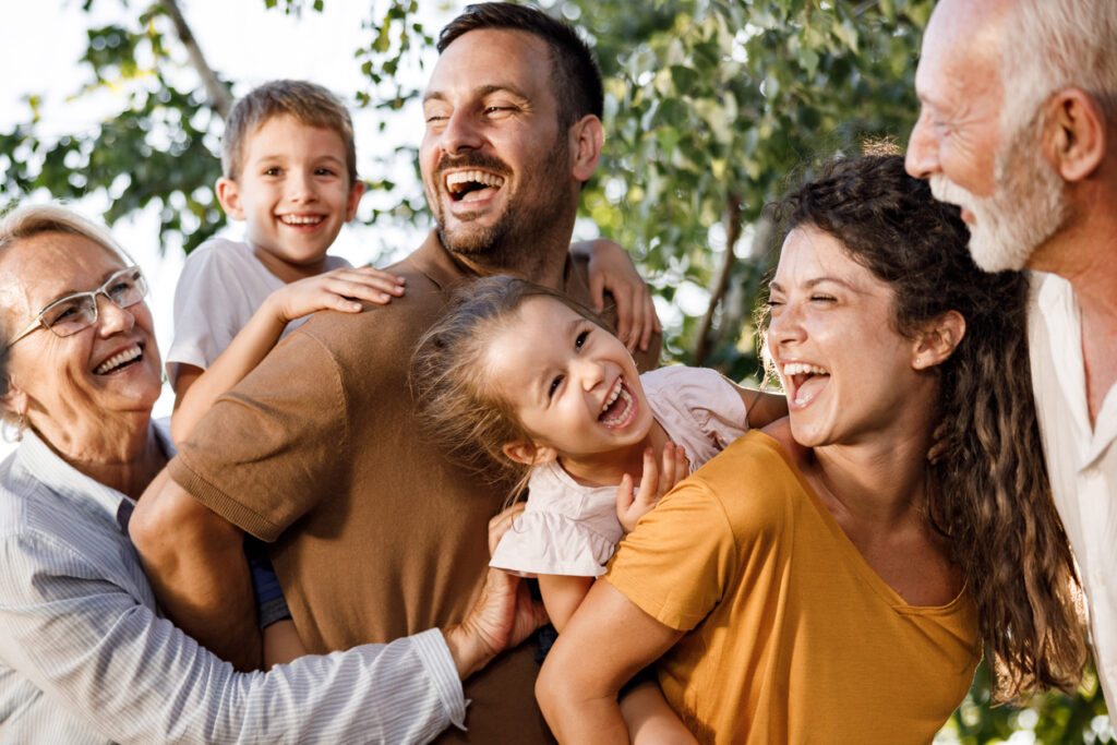 Cheerful multi-generation family having fun in nature. Image credit: iStock