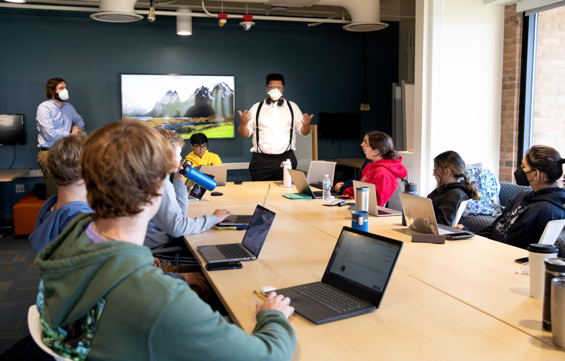 Jesse Austin-Breneman, assistant professor of mechanical engineering, speaks to his students in a class titled Engineering for Social Impact: Making a Better World. (Photo by Marcin Szczepanski, College of Engineering)