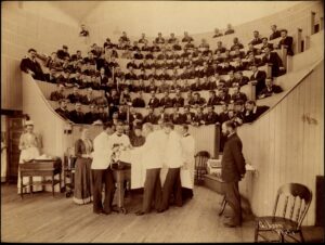 Demonstration in medical school amphitheater (includes Alice Hamilton, 3rd row, 8th from left), ca. 1893