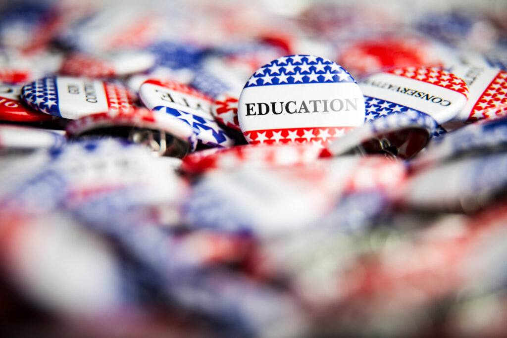 Closeup of election vote button with text that says Education. Image credit: iStock