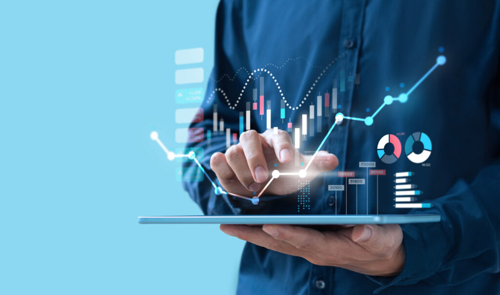 Businessman trading online stock market on tablet screen, digital investment concept. Image credit: iStock