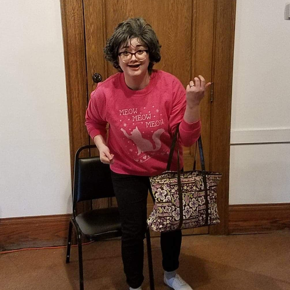 Beth Dutridge-Corp, an LSA graduate education program manager, performs as Carol, a craft-loving character she created for the “Mr. Tasty: Flavor of the Month” independent sketch show at Riverside Arts Center in Ypsilanti. (Photo courtesy of Beth Dutridge-Corp)