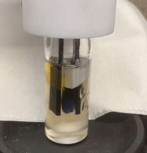 Former postdoctoral researcher Danielle Fagnani used electrochemistry to chemically recycle polyvinyl chloride in a reaction vessel. Image credit: Danielle Fagnani