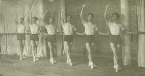 Male dancers pose at the ballet bar. Contributor: Zhao Dexian 赵得贤/조 득현 (1913-2002)