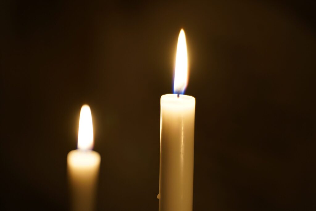Two candles burning. Image credit: Julian Kendziora, Pexels.com