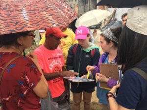 Students work on survey collection. Image Credit: Bruno Kelly