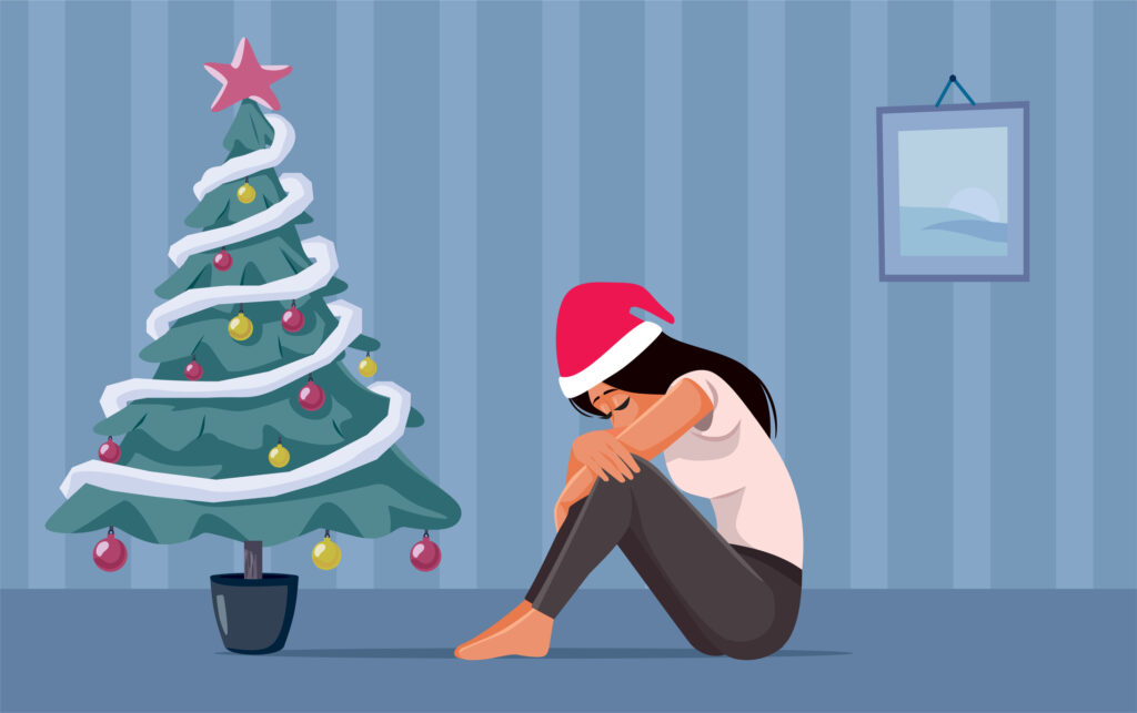 Anxious girl spending winter holidays alone and depressed. Image credit: iStock