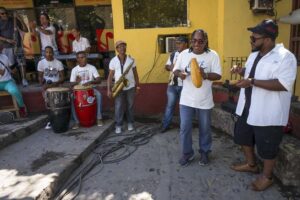 Kayvon Gordon (right) playing claves