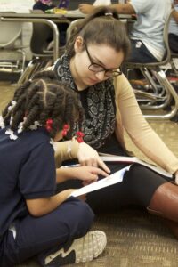 Learning to read with an M-ARC teacher. Image credit: Angela Marocco