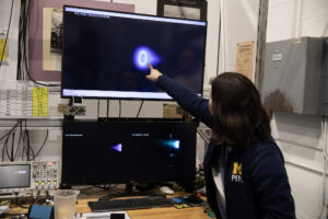 Ph.D student Leanne Su works in the PEPL lab on the new Hall thruster developed by a team lead by Benjamin Jorns, U-M associate professor of aerospace engineering. Image credit: Marcin Szczepanski/Lead Multimedia Storyteller, University of Michigan College of Engineering