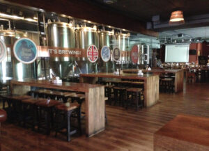 All eyes are drawn to the giant tanks filled with local brews that flow directly to the taps. (Image Credit: Mandira Banerjee)