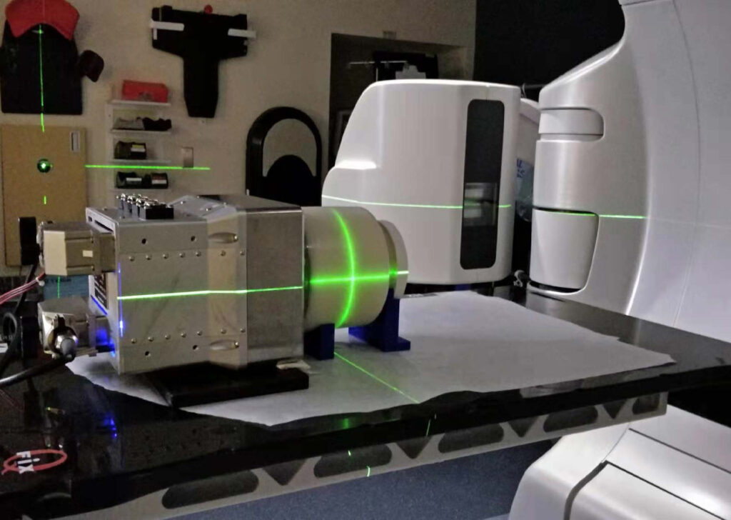 Experimental setup for U-M’s iRAI system (metal box on left) using a lard "phantom" (cylinder at center) that approximates the human body. Image credit: U-M Optical Imaging Laboratory