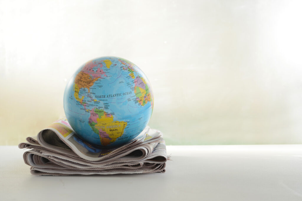 Newspaper and Globe. Image credit: Burak Can Oztas, iStock