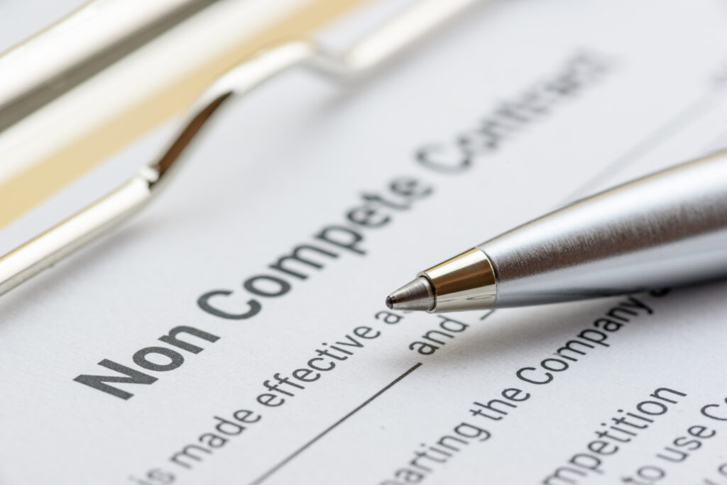 Legal concept : Blue ballpoint pen on a non compete contract. Noncompete contract is an agreement between employee and employer, not to enter into competition in subsequence business effort. Image credit: William_Potter, iStock