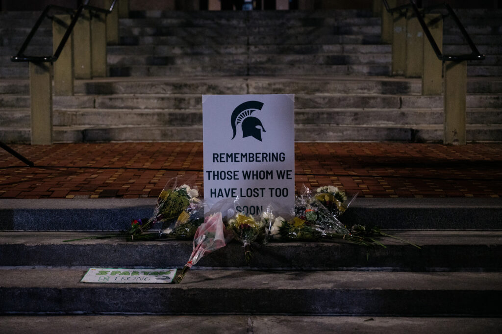 The University of Michigan community gathers for a vigil to mourn the Michigan State University students who were killed and injured during a mass shooting earlier this week on Wednesday, Feb. 15, 2023.