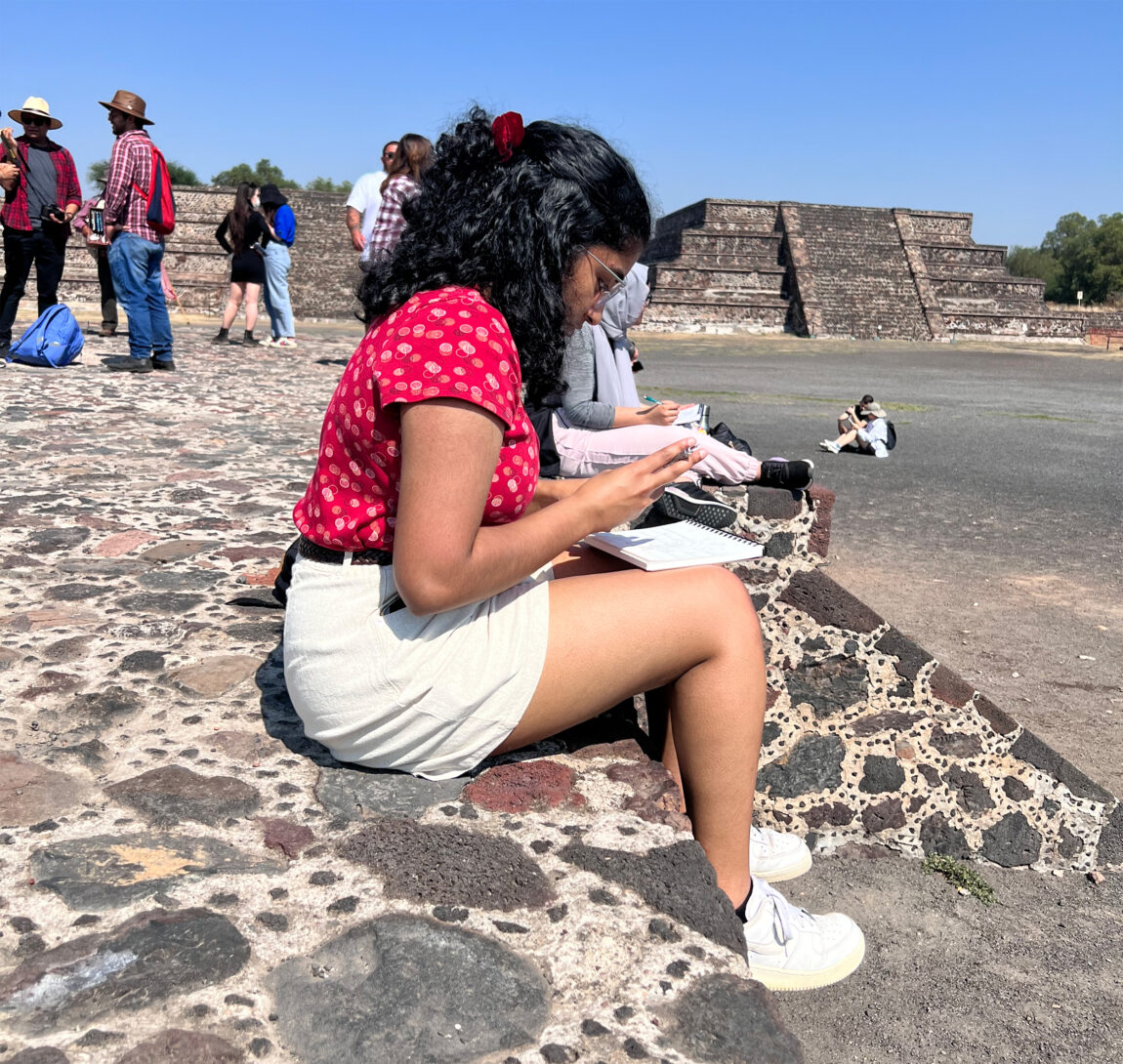 Meghana Tummala, an undergraduate at the A. Alfred Taubman College of Architecture and Urban Planning, sketches the Teotihuacán Pyramids during a study abroad trip to Mexico City. (Photo by Stephanie Rosas)