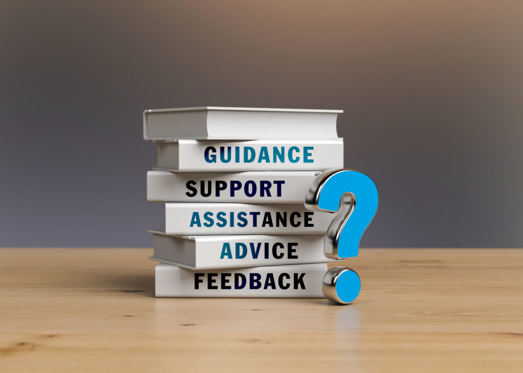 Blue-colored question mark and stack of books. Horizontal composition with copy space. Image credit: Baris-Ozer, iStock