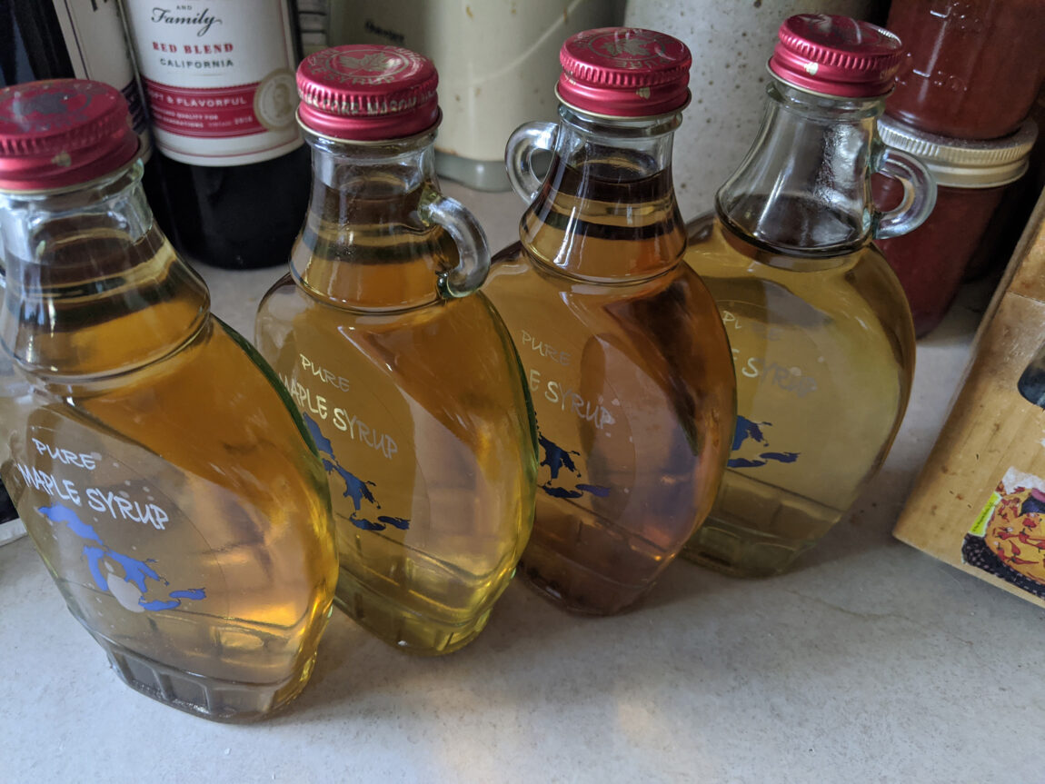 The syrup that Frank and Theresa Marsik make from their sugar maple tree is stored in decorative jars. (Photo courtesy of Frank Marsik)
