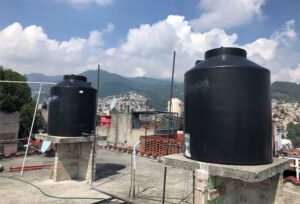 Tinacos, rooftop storage tanks, are a common component of household water storage infrastructures. Photo taken by Alyssa Huberts. Image courtesy: Research Center for Group Dynamics