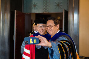President Ono takes a selfie with one iof the inauguration attendees.