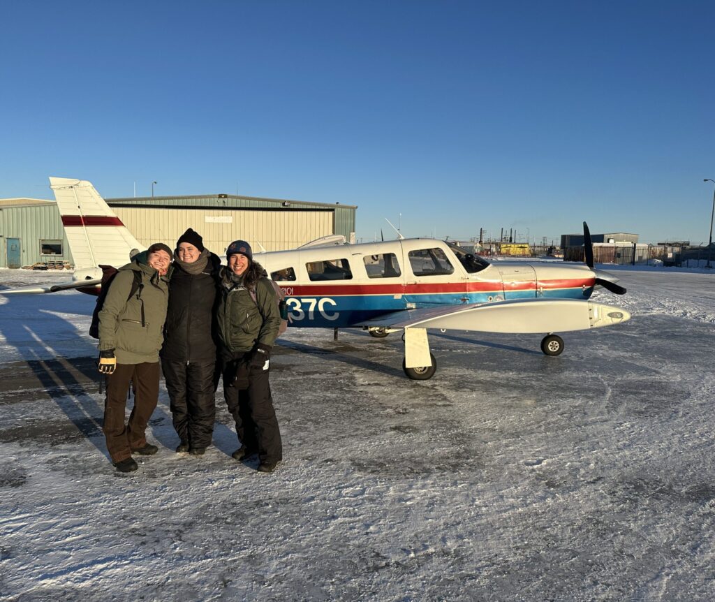 From left to right: Kelsey Porter, Megan Leys, and Lisa Wexler, the Family Safety Net study team, arriving in rural Alaska for data collection. Image courtesy: Kelsey Porter
