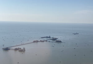 Central-hub multi-platform complexes in the Gulf of Mexico emit far more methane than official inventories report, according to a study led by the University of Michigan. Researchers flew over the region in a Mooney airplane to measure greenhouse gas emissions. This photo, from one of their flights, shows a central hub collecting oil and gas from surrounding smaller satellite production platforms. Image courtesy: Paolo Wilczak.