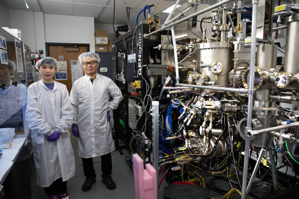 Electrical & Computer Engineering research scientist Ding Wang and graduate student Minming He from Prof. Zetian Mi's group, University of Michigan, are working on the epitaxy and fabrication of high electron mobility transistors (HEMTs) based on a new nitride material, ScAlN, which has been demonstrated recently as a promising high-k and ferroelectric gate dielectric that can foster new functionalities and boost device performances." Image credit: Marcin Szczepanski/Lead Multimedia Storyteller, Michigan Engineering