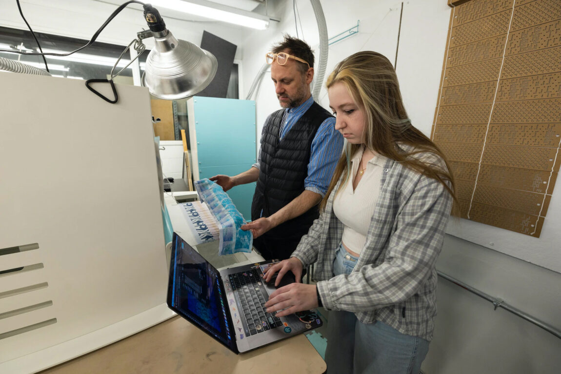 Lecturer Michael Andrews works with a student on one of the Penny W. Stamps School of Art & Design’s Thread Controller 2 digital Jacquard looms. (Photo by Scott Galvin)