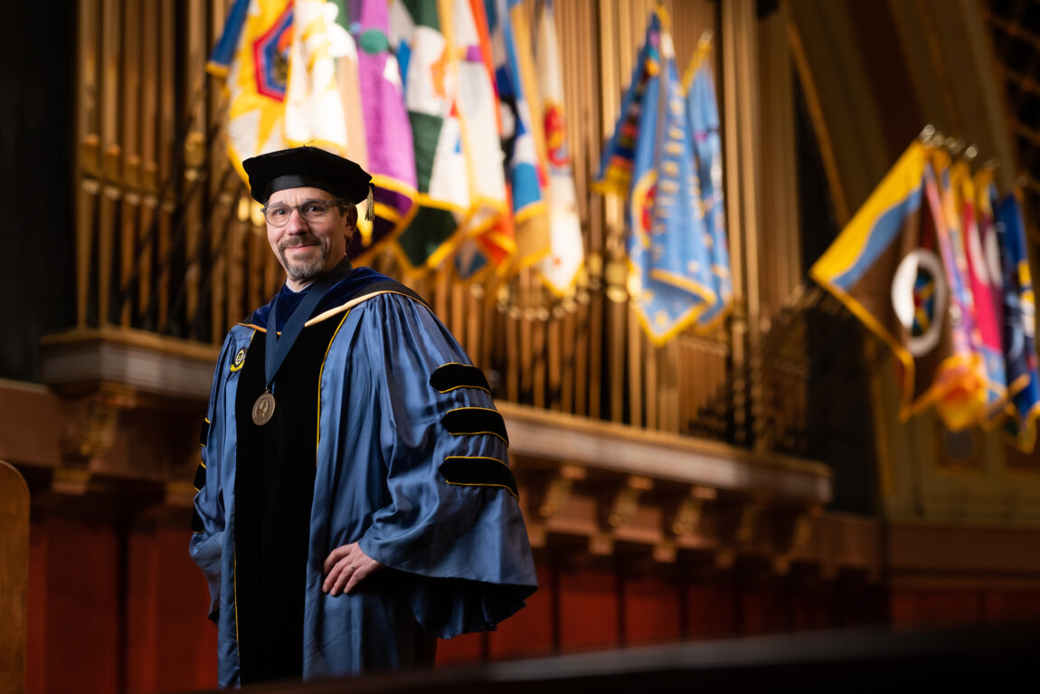 Mika LaVaque-Manty poses at Hill Auditorium, the site of many ceremonies where he has served as U-M’s chief marshal. LaVaque-Manty is preparing for his final commencement as chief marshal. (Photo by Austin Thomason, Michigan Photography)