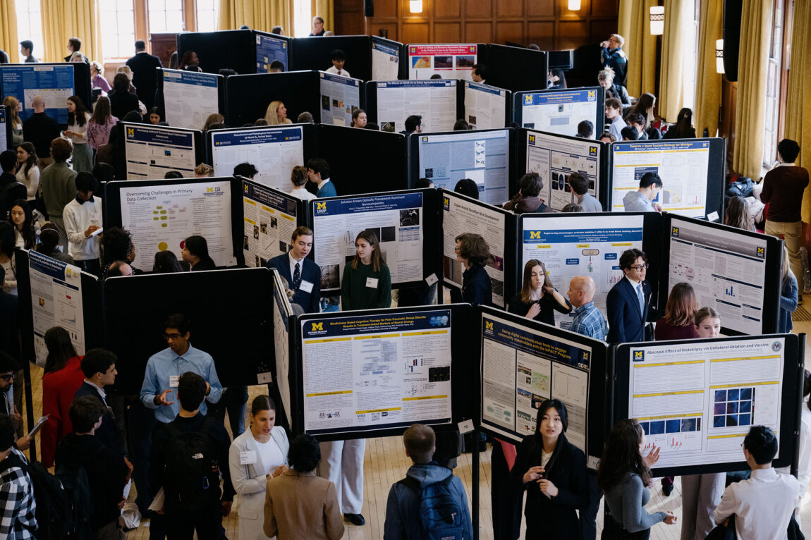 Overall photo of mentors and mentees in the Undergraduate Research Opportunity Program showcase.