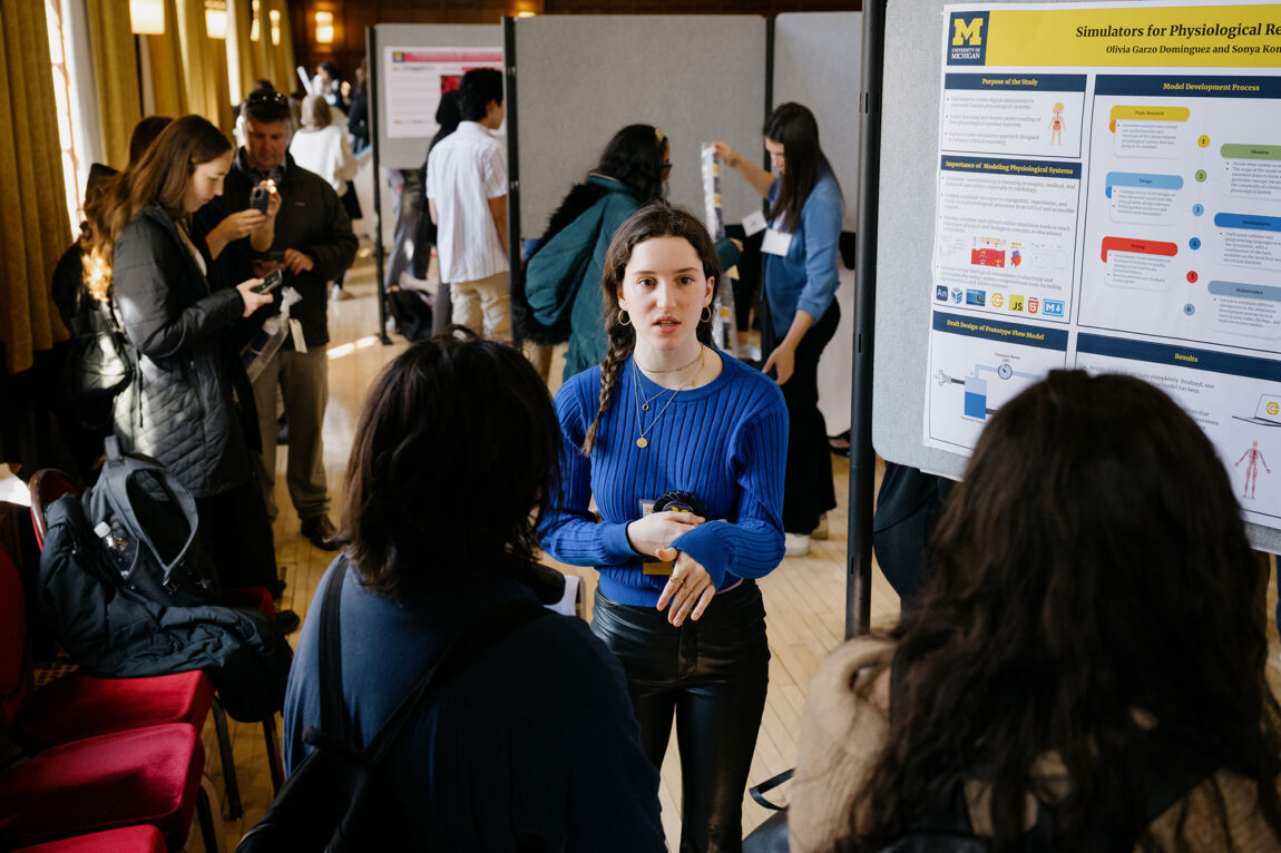 Photo of LSA freshman Olivia Garzo Dominguez sharing information about her research project.