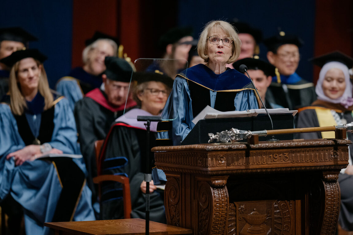 Photo of President Emerita Mary Sue Coleman delivering the Rackham Graduate Exercises address