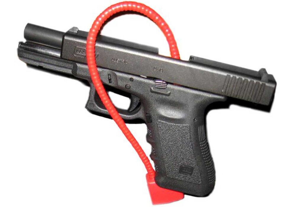 A handgun with a cable lock. Image credit: Kencf0618, CC BY-SA 3.0, via Wikimedia Commons