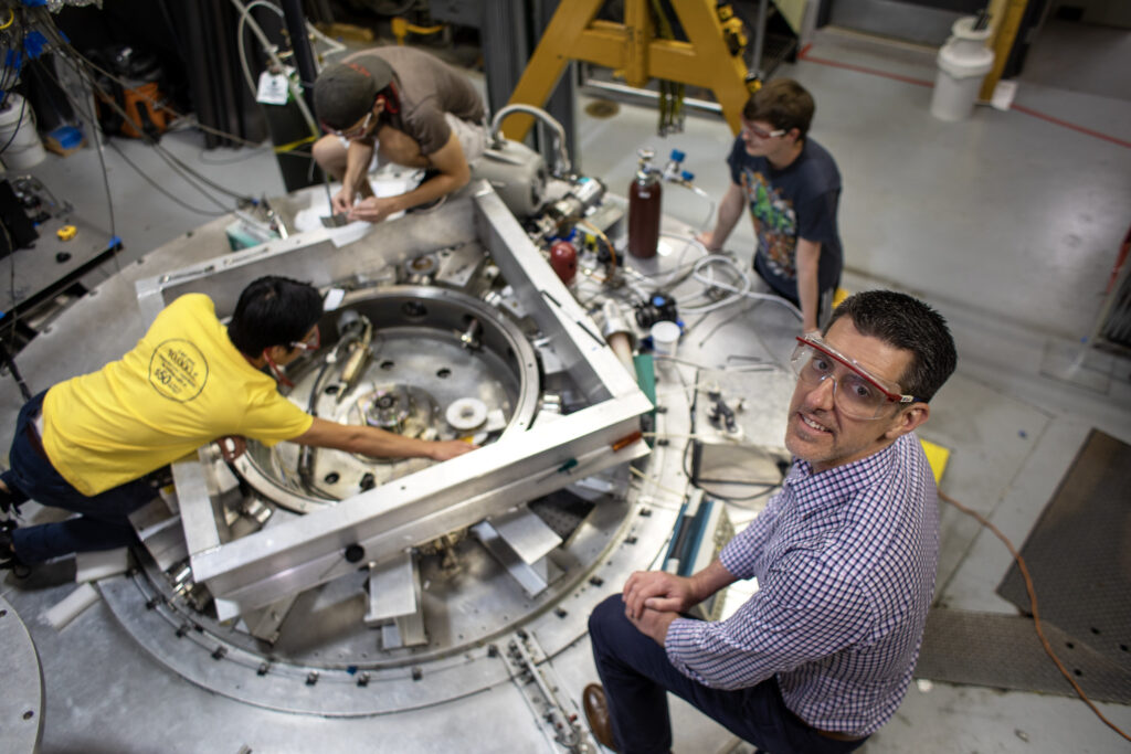 Professor Ryan McBride, graduate students Joe Chen, George Dowhan and undergraduate student Evan Mahler at work on the 200-kV, 1-MA, 100-ns MAIZE facility at the Plasma, Pulsed Power, and Microwave Laboratory. Image credit: Marcin Szczepanski, Michigan Engineering