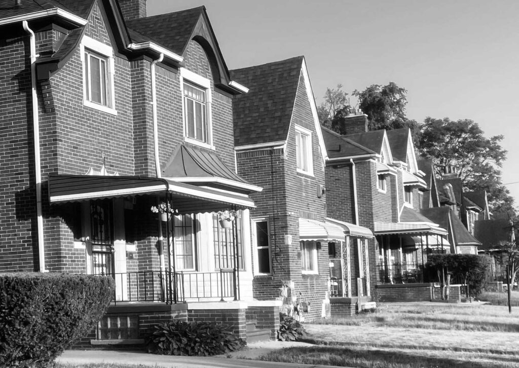 A row of houses in Detroit. Image courtesy: U-M Poverty Solutions