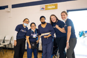 Students from the HEART Clinic help stroke patient Cynthia Cummings, center, with assisted mobility and heart rate monitoring. Emma DeBaake Brighton, second from the right, is a second-year physical therapy doctoral student, who heads Cummings' therapy. Image credit: Eric Bronson, Michigan Photography