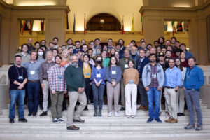 The North American Nanohertz Observatory for Gravitational Waves (NANOGrav) is a collaboration of faculty, researchers and students from institutions around the globe. University of Michigan astrophysicist Kayhan Gultekin, front row, second from right, is a co-author of the set of papers describing the first evidence for low-frequency gravitational waves permeating the cosmos. Image credit: NANOGrav Collaboration
