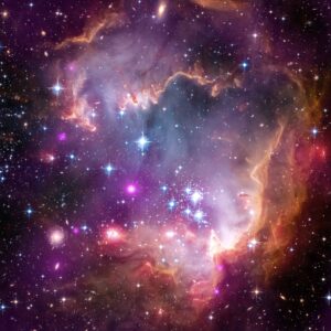 NASA's Great Observatories imaged the tip of the "wing" of the Small Magellanic Cloud galaxy. The Small Magellanic Cloud, or SMC, is a small galaxy about 200,000 light-years away that orbits the Milky Way. Image credit: NASA/CXC/JPL-Caltech/STScI