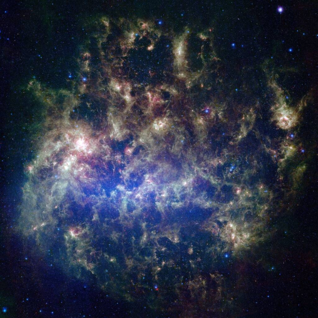 The Large Magellanic Cloud, a satellite galaxy to our own Milky Way galaxy, is located 160,000 light-years from Earth, and is a dwarf galaxy that orbits the Milky Way. Image credit: NASA/JPL-Caltech/STScI