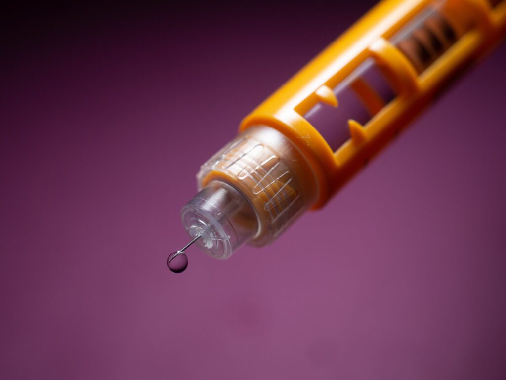 Novolog insulin pen, 4mm bd nano needle with a drop of insulin coming out. Image credit: Dennis Klicker, Unsplash 