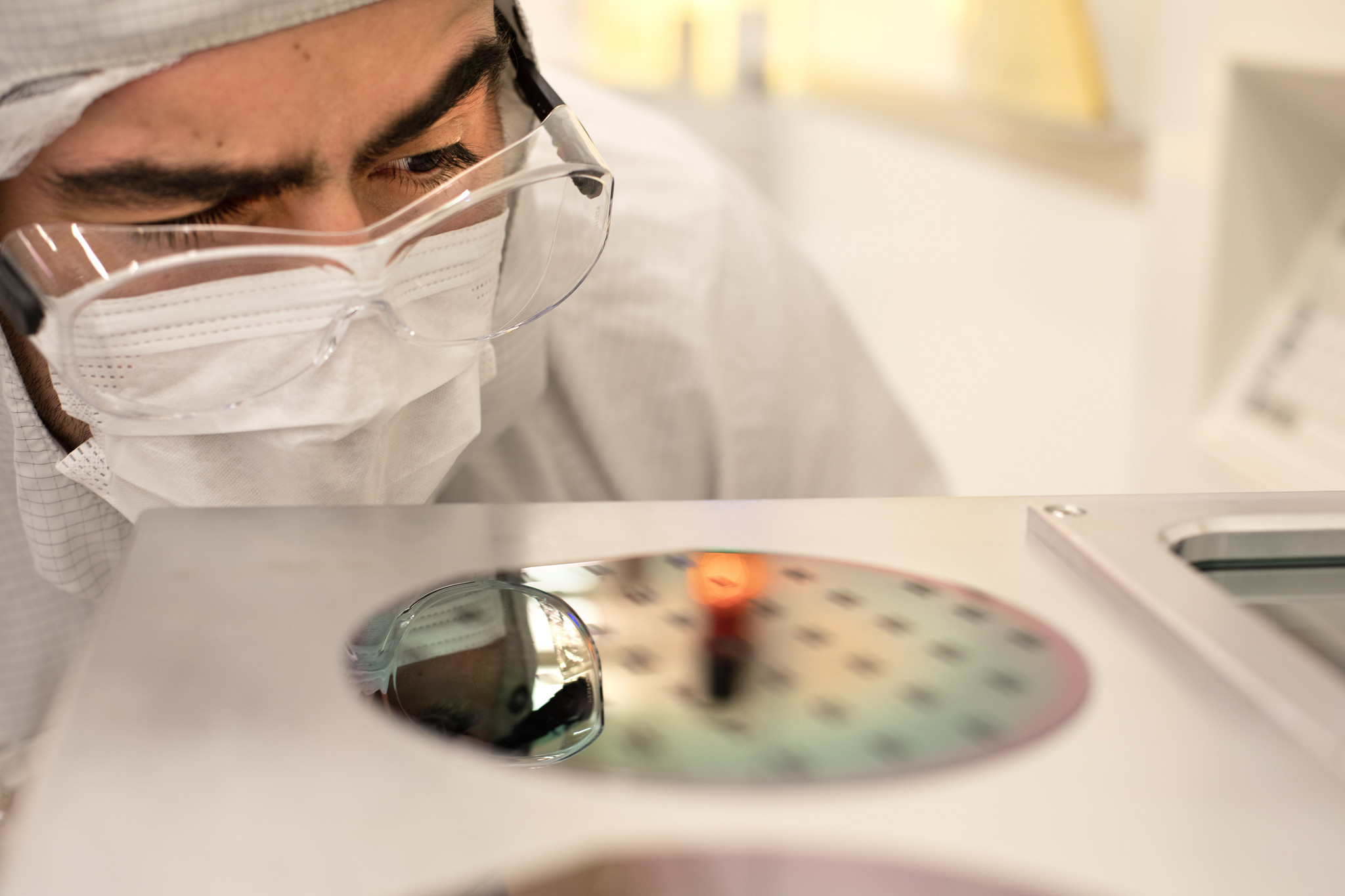 Allan Flores, a student participant at the M-SHORE program examines results of an experiment at the Michigan Lurie Nanofabrication Facility. Image credit: Marcin Szczepanski, Michigan Engineering