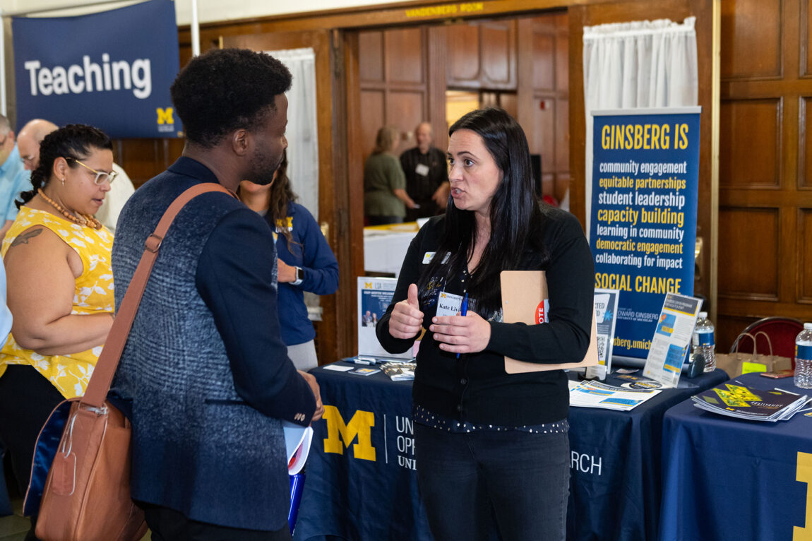 Photo of Kate Livingston of the Ginsberg Center talking with Tajudeen Mamadou Yacoubou.