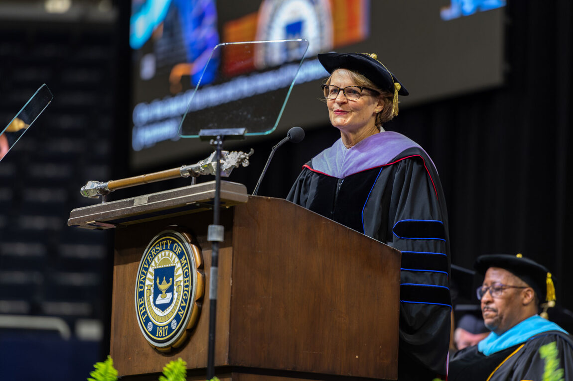 Photo of Provost Laurie McCauley at the podium delivering her welcome remarks.